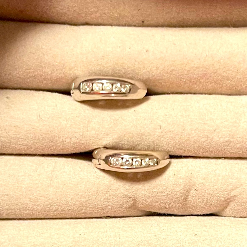 Custom designed 14K white gold earrings with 10 channel set diamonds.